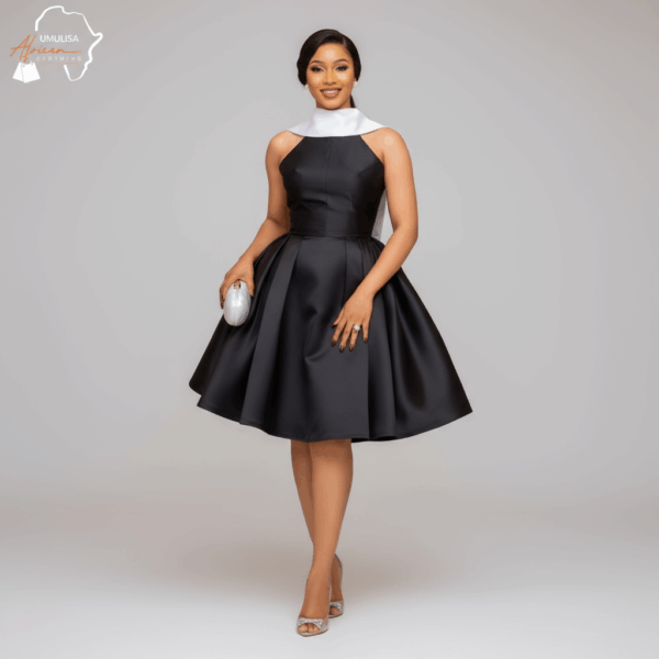A_black_model_wearing__subject_1___with_a_pose_that_clearly_demonstrates_the_design_and_fit_of_the_d (2) Elegancia Black & White Cocktail Dress